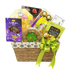 Gift basket with flowers, dates, cookies and chocolates for flower delivery in Singapore