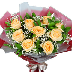 Elegant bouquet of pale yellow roses with baby's breath and greenery for flower delivery