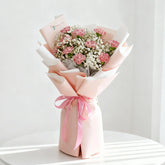 Elegant pink carnation bouquet with white baby's breath, perfect for flower delivery gift