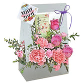 Pink flower bloom box with roses and carnations, ideal for same-day flower delivery in Singapore