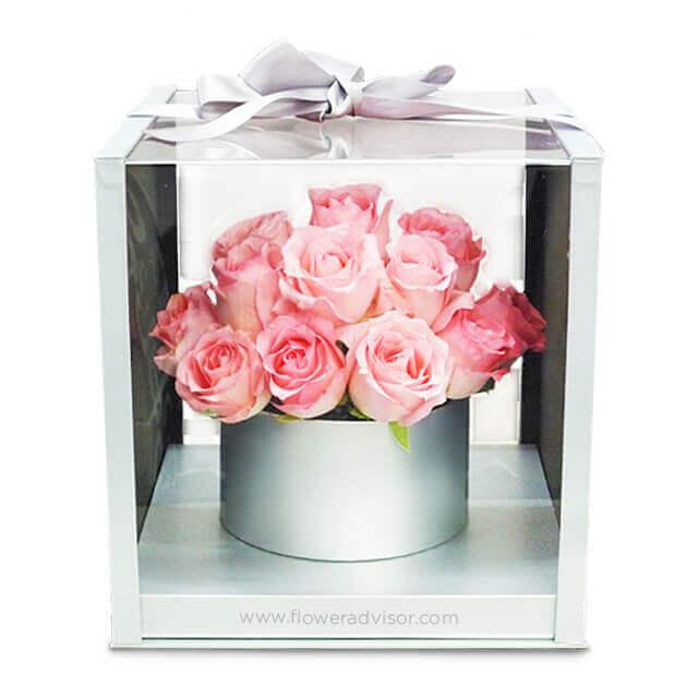 Pink rose bouquet in silver box, elegantly gift-wrapped for flower delivery