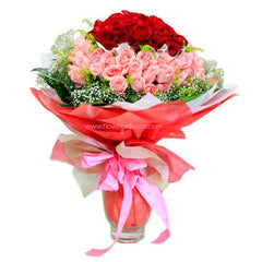 Elegant bouquet of red and pink roses with baby's breath, ideal for flower delivery gifts