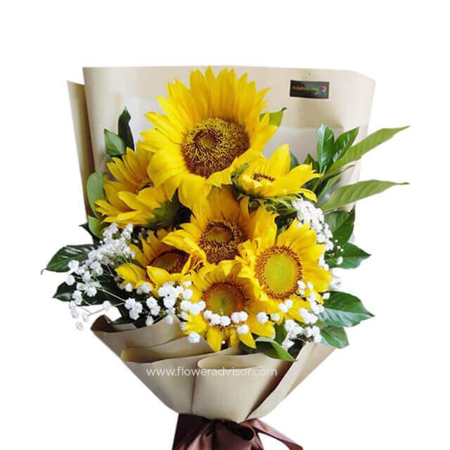 Sunflower bouquet with greenery and white filler flowers for fresh flower delivery