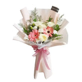 Hand-tied bouquet with pink gerberas and white roses for flower delivery in Singapore
