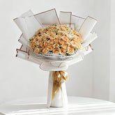 Elegant bouquet of peach roses wrapped in white, ideal for flower delivery in Singapore