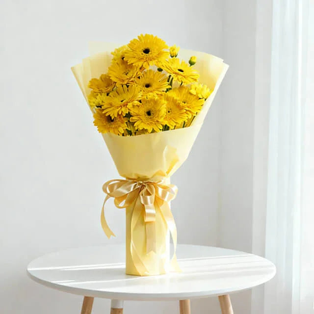 Yellow gerbera daisy bouquet with ribbon, perfect for flower delivery in Singapore