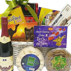 Gift hamper with festive treats, cookies, dates, and sparkling drink for flower delivery