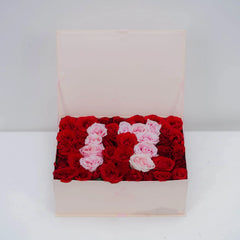 Red and pink roses arranged in a heart shape for flower delivery