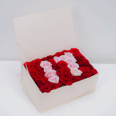 Flower delivery box with red and pink roses arranged in the shape of the number 11