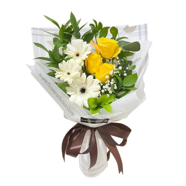 Hand-tied bouquet with yellow roses and white gerberas, perfect for flower delivery in Singapore