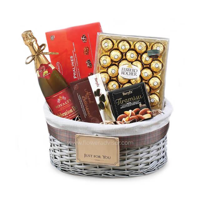 Gift basket with chocolates, sparkling juice, and pralines for same-day flower delivery