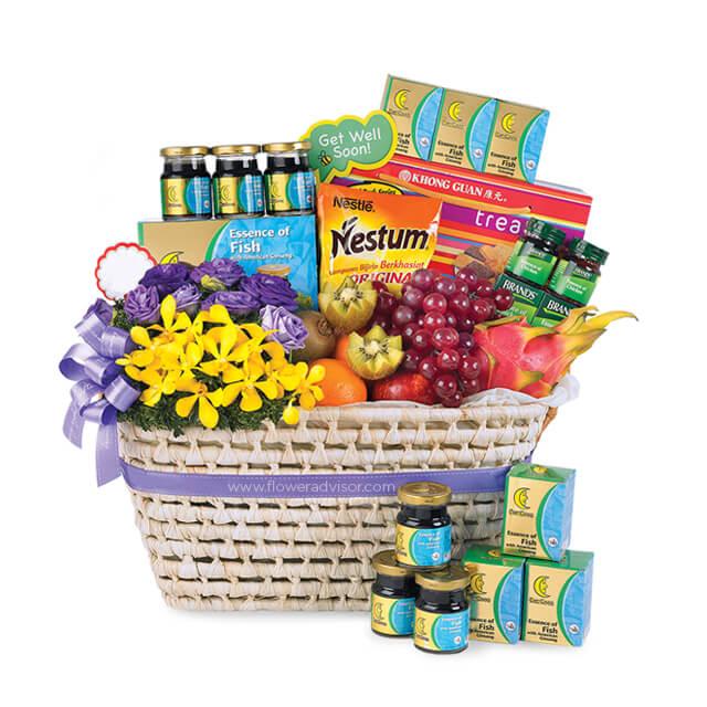 Flower delivery basket with fresh yellow and purple flowers, fruits, and wellness gifts