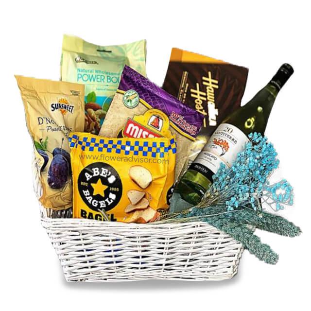 Gift hamper with snacks, wine, and dried flowers for flower delivery in Singapore