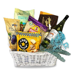 Gift hamper with snacks, wine, and dried flowers for flower delivery in Singapore
