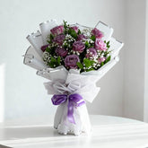 Hand-tied bouquet of purple roses with baby’s breath for flower delivery in Singapore