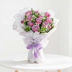 Hand-tied pink rose bouquet with baby's breath, ideal for Singapore flower delivery
