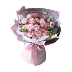 Elegant pink rose bouquet in pastel wrapping, ideal for flower delivery in Singapore