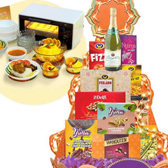Gift hamper with assorted snacks, cookies, drinks, and dinnerware for festive flower delivery