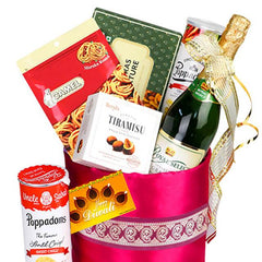 Gift hamper with snacks, sweets, drink and festive ribbon for flower delivery Singapore