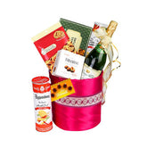 Festive gift hamper with wine, cookies, snacks, and sweets for flower delivery in Singapore