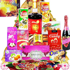 Assorted festive hamper with snacks, cookies, drinks and flowers for gift delivery Singapore