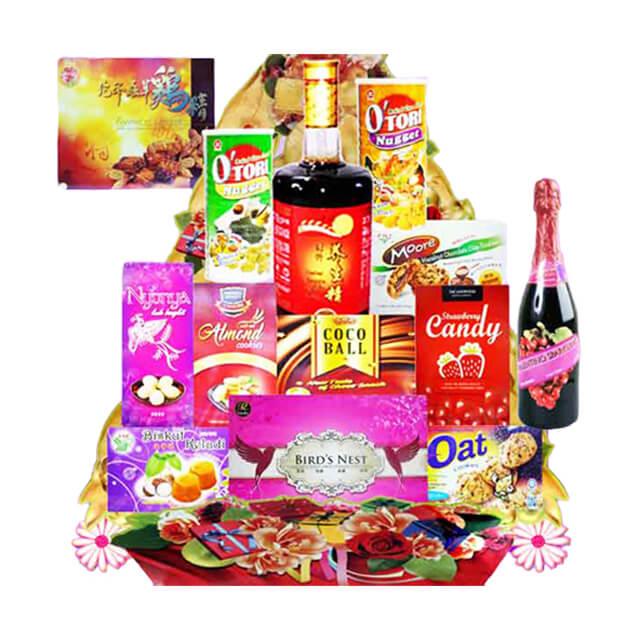 Gift hamper with assorted snacks, drinks, and festive packaging for flower delivery Singapore