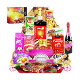Gift hamper with assorted snacks, drinks, and festive packaging for flower delivery Singapore