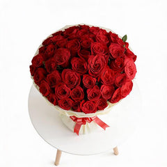 Large bouquet of fresh red roses with ribbon, perfect for flower delivery in Singapore