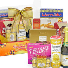 Festive gift hamper with assorted snacks, chocolates, drinks, ideal for flower delivery gifts