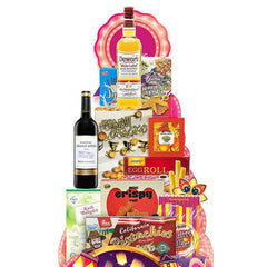 Assorted gourmet hamper with wine, snacks, and treats for festive flower delivery gift.