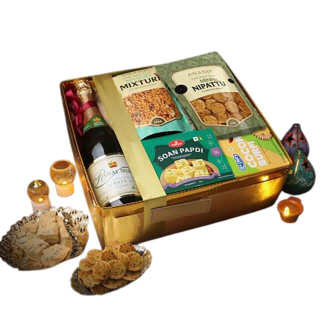 Premium gift hamper with festive snacks, sweets, and sparkling drink for delivery in Singapore