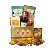 Diwali hamper with snacks, sweets, sparkling drink, and decorative box for festive flower delivery