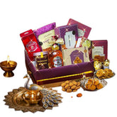 Festive gift hamper with assorted snacks and sweets, ideal for flower delivery gifting