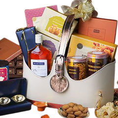 Premium gift hamper with assorted snacks, festive treats, and flowers for delivery.
