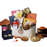Luxury gift hamper with snacks, sweets, and drinks, ideal for festive flower delivery in Singapore