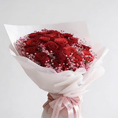 Elegant red rose bouquet with pink baby's breath, perfect for flower delivery in Singapore