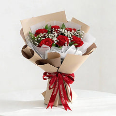 Red rose bouquet with baby's breath in brown wrapping, perfect for flower delivery in Singapore