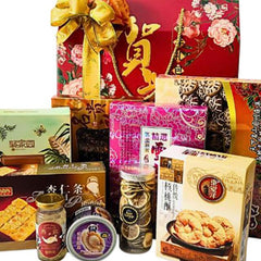 Chinese New Year gift hamper with snacks, dried fruits and festive packaging for delivery