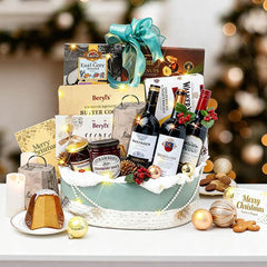 Festive Christmas hamper with wine, cookies, and flowers for holiday gift delivery
