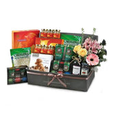 Gift hamper with fresh flowers and assorted snacks, ideal for Singapore flower delivery