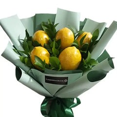 Fresh bouquet with lemons and green leaves, ideal for unique flower delivery gifts