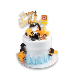 Construction-themed birthday cake with toy trucks and 'Happy Birthday' topper for flower delivery
