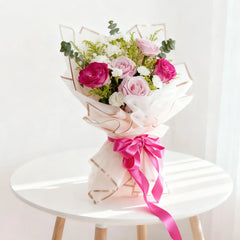 Pastel bouquet with pink roses and white flowers, ideal for flower delivery in Singapore
