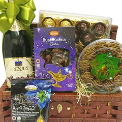 Gift hamper with dates, pastries, chocolates, sparkling drink and green ribbon, suitable for flower delivery and celebration gifts.