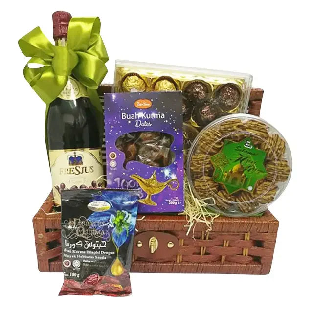 Festive gift basket with dates, chocolates, snacks and a bottle, perfect for flower delivery gifts