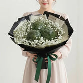 Woman holding unique vegetable bouquet with broccoli and white flowers for flower delivery