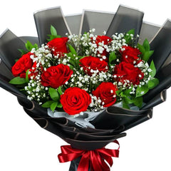 Red rose bouquet with baby's breath and greenery, ideal for flower delivery gift