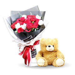 Bouquet of red and white roses with gift ribbon, paired with teddy bear for flower delivery