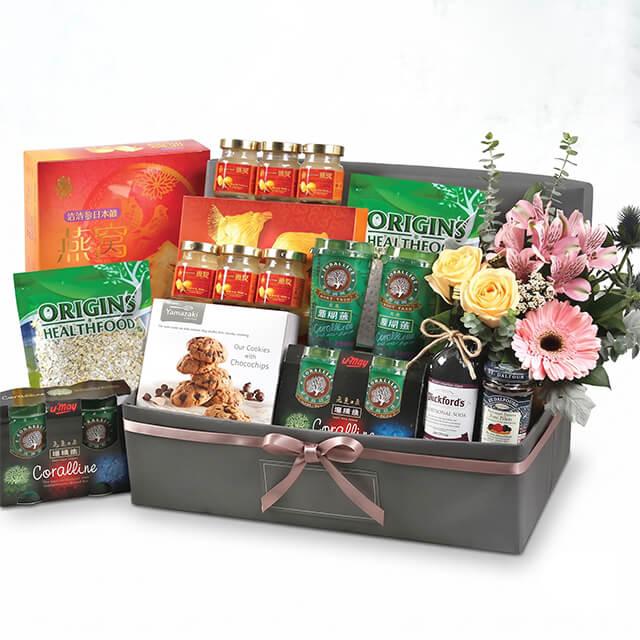 Luxury flower and gourmet hamper with roses, orchids, cookies, and health foods for same-day delivery