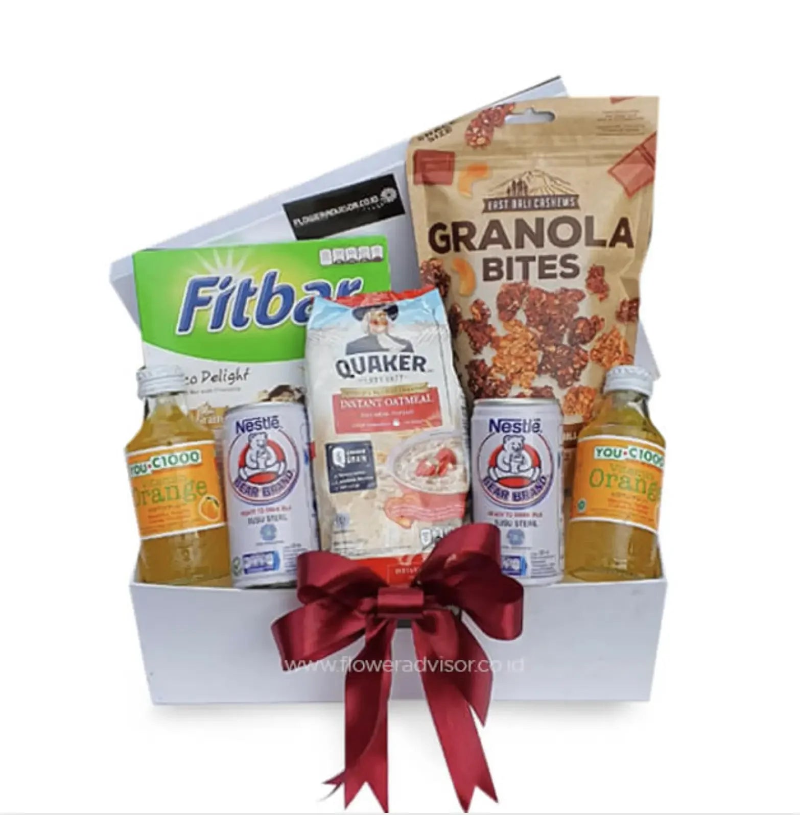 Healthy snack hamper with granola, Fitbar, oatmeal and drinks for flower delivery gift